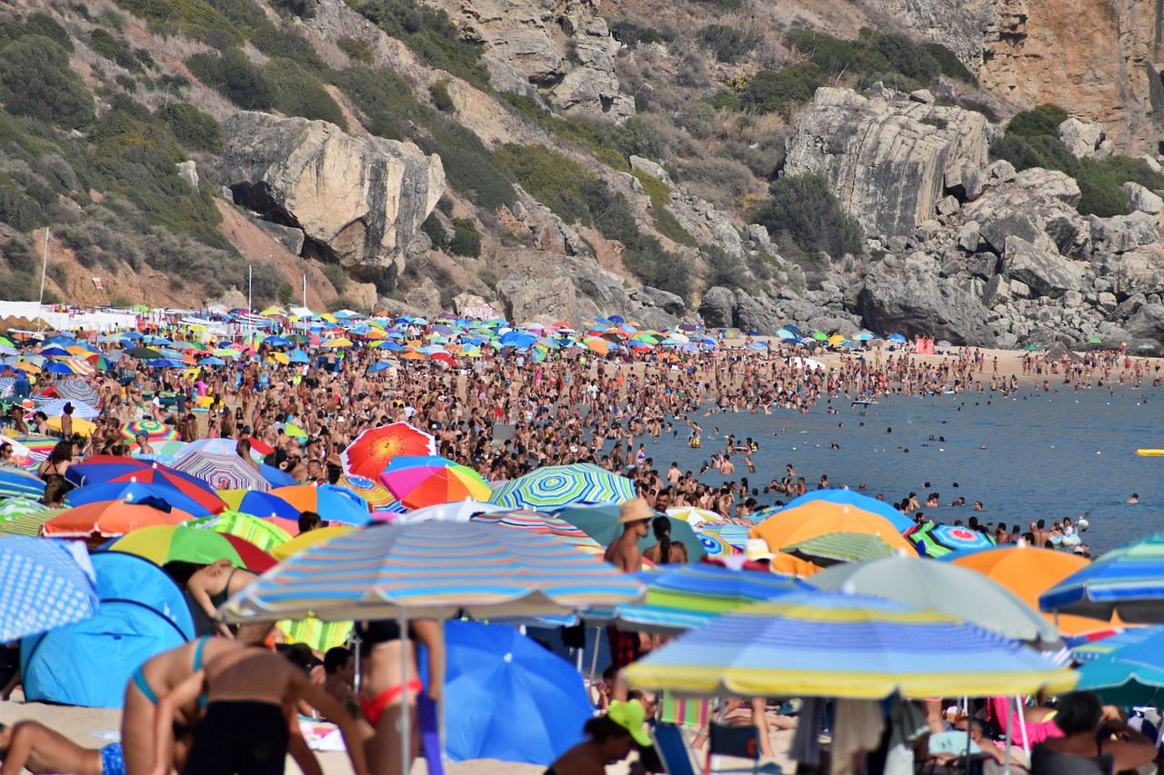 Tourist crowding a beach in a heat wave